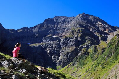 Girl at Gollingwinkel looking up the North face of Hochgolling